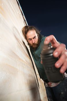 Close up of spray paint can held by graffiti artist