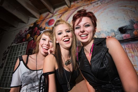Cute urban teenage girls laughing together
