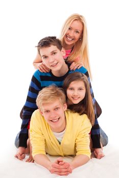 Brothers and sisters lying on a floor together