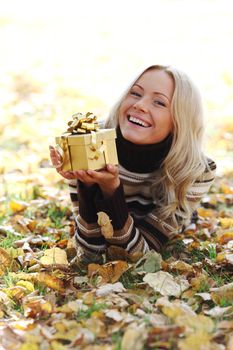 woman take autumn gift in park