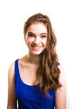 An attractive teen poses for a photo indoors in a lighting studio against a white background with a fashion style feel to the image.