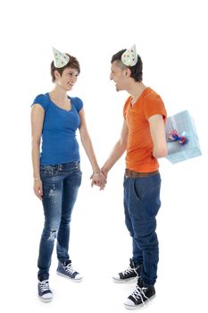 a happy boy is having a present for his birthday girl on a white background