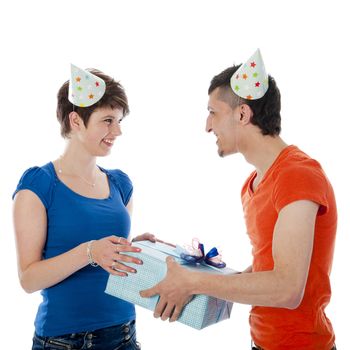 a happy boy is having a present for his birthday girl on a white background