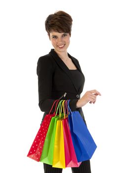 a girl with a lot of shopping bags in all kind of colors