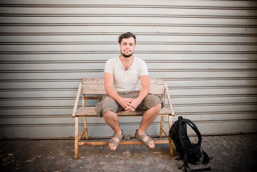 young stylish man sitting on a banch in the city







young stylish man sitting on a banch