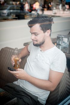 young stylish man in a bar in the city