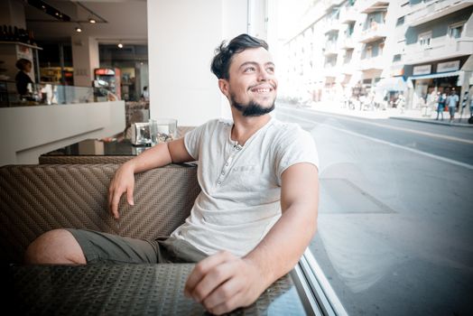 young stylish man in a bar in the city