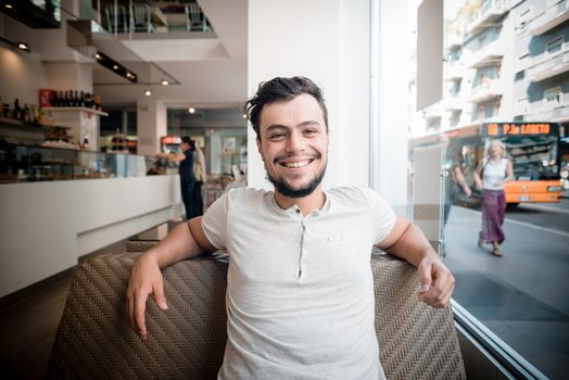 young stylish man in a bar in the city