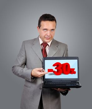 businessman with a laptop in hand points to discount