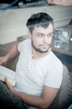 young stylish man in a bar in the city