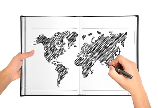 Hands drawing world map in book