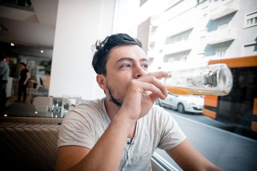 young stylish man in a bar in the city