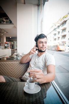 young stylish man in a bar in the city