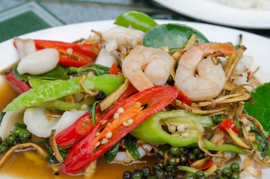 close up fried herbal vegetables with mix seafood