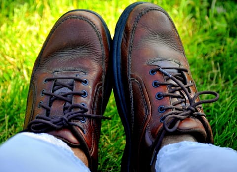 Man relaxing in the grass outdoors.