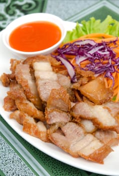 fried pork  served with vegetable and red chili sauce