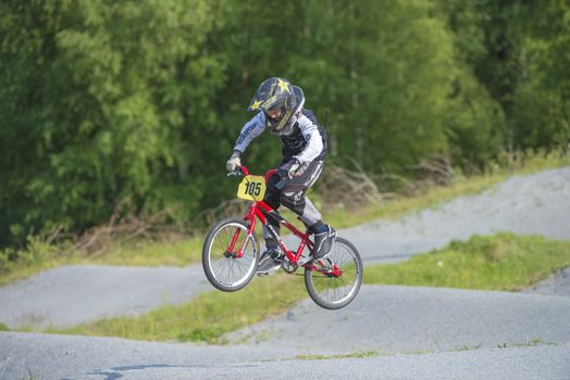 My grandson is an active BMX cyclist, the pictures are shot in Aremark Municipality, Norway where the Bmx track is.