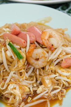 close up of  Pad Thai ,   stir fried  noodles with shrimp ,sausage ,  egg  and vegetable