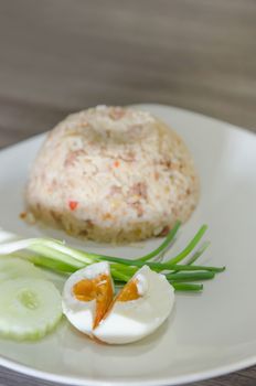 close up salted egg ,  fresh vegetable and fried rice on dish