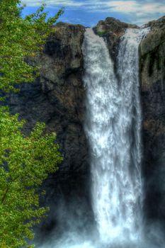 Water going over the falls at a national forest in HDR