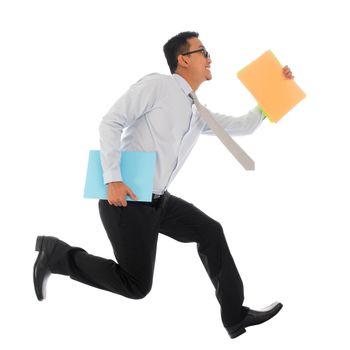 Full body young Asian businessman in hurry running or jumping up with some file and documents in his hand, isolated on white background