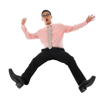 Full body shocked young Asian businessman falling backwards open arms, isolated on white background