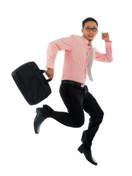 Full body young attractive Asian businessman in hurry running or jumping up with a briefcase, isolated on white background