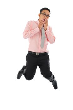 Full body young Asian businessman get shock, hands covering mouth and jumping up  isolated on white background