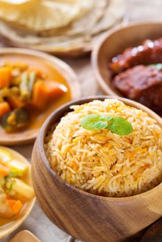 Biryani rice or pilaf rice with curry, fresh cooked basmati rice with spices, delicious Indian food.