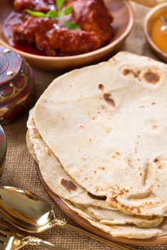 Chapati or Flat bread, Indian chapatti, dhal and chicken curry, popular Indian food.