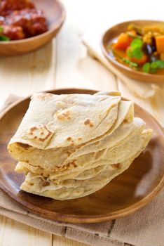 Chapati or chapatti, Indian dhal and chicken curry, popular Indian food.