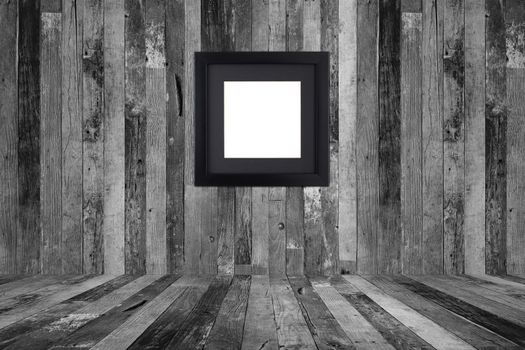 Picture frame on the old wooden wall