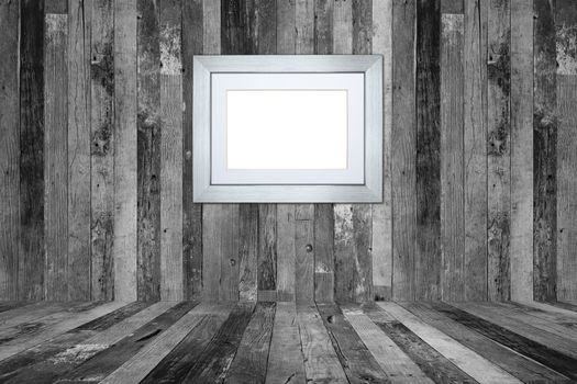 Picture frame on the old wooden wall