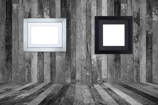 Picture frames on the old wooden wall