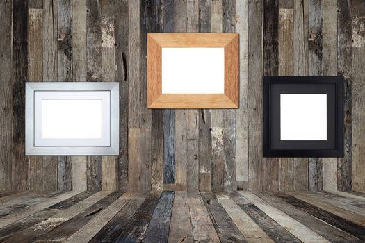 Wooden picture frames on the old wooden wall