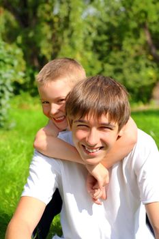 happy brothers in the summer park