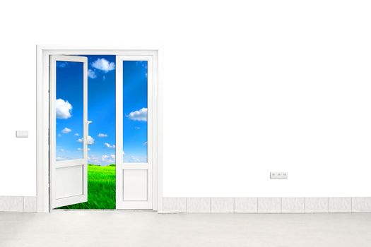 open door with sky and green field in the background