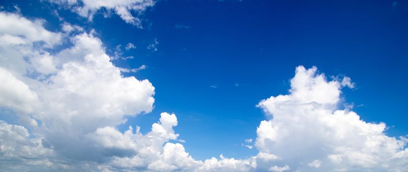 blue sky background with tiny clouds