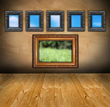 abstract interior with ancient beautiful wooden frames on wall -  you can see outside through them