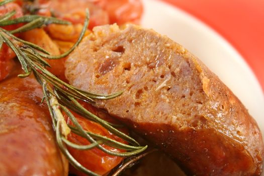 Delicious beef sausage and cherry tomato bake with rosemary.