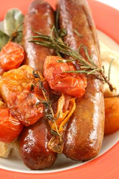 Delicious beef sausage and cherry tomato bake with rosemary.