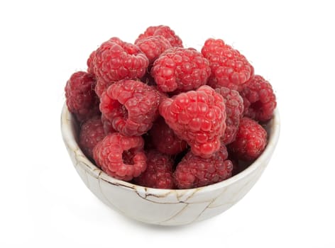 cup of raspberries over white background