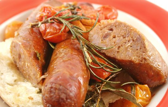 Delicious beef sausage and cherry tomato bake with rosemary.