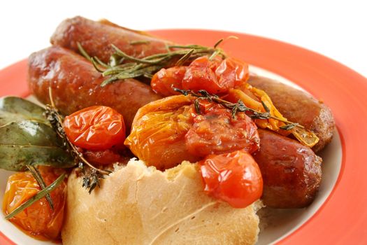 Delicious beef sausage and cherry tomato bake with rosemary.