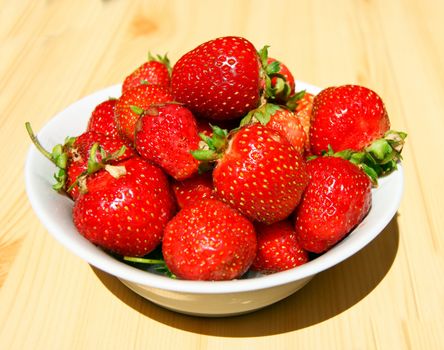 Plate with berry strawberry on table