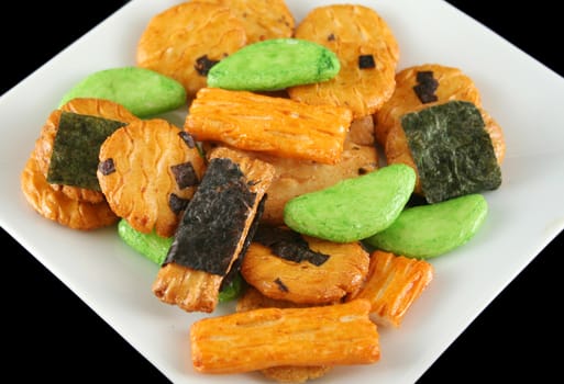 Crunchy multi colored Asian rice crackers ready to serve.