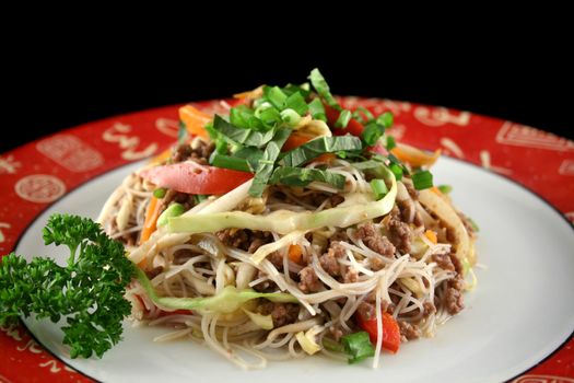 Stirfry beef chow mein with fresh Chinese vegetables.