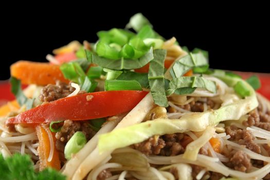 Stirfry beef chow mein with fresh Chinese vegetables.