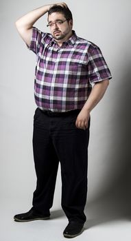 Man scratching his head with wondering expression
