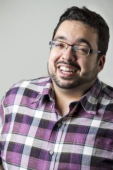 portrait of an overweight man in the middle of a laugh